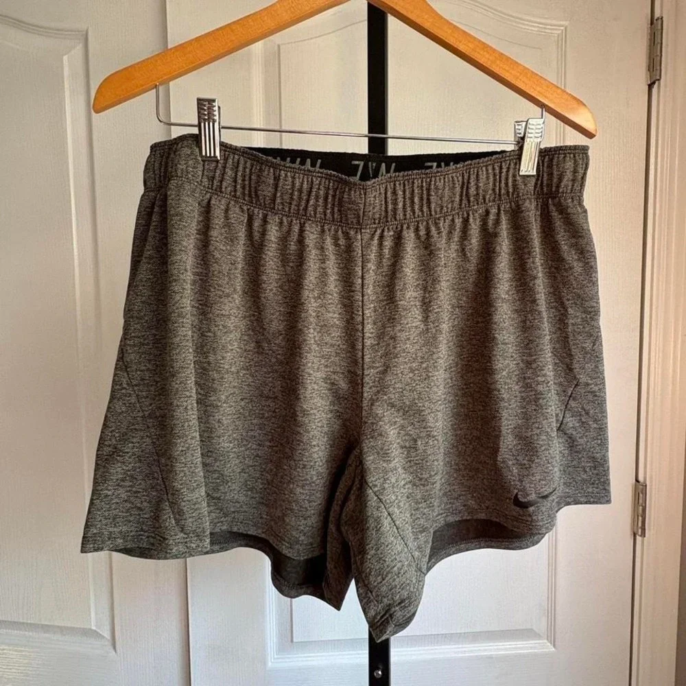 Grey Nike Dri-Fit shorts and underarmour shorts‎